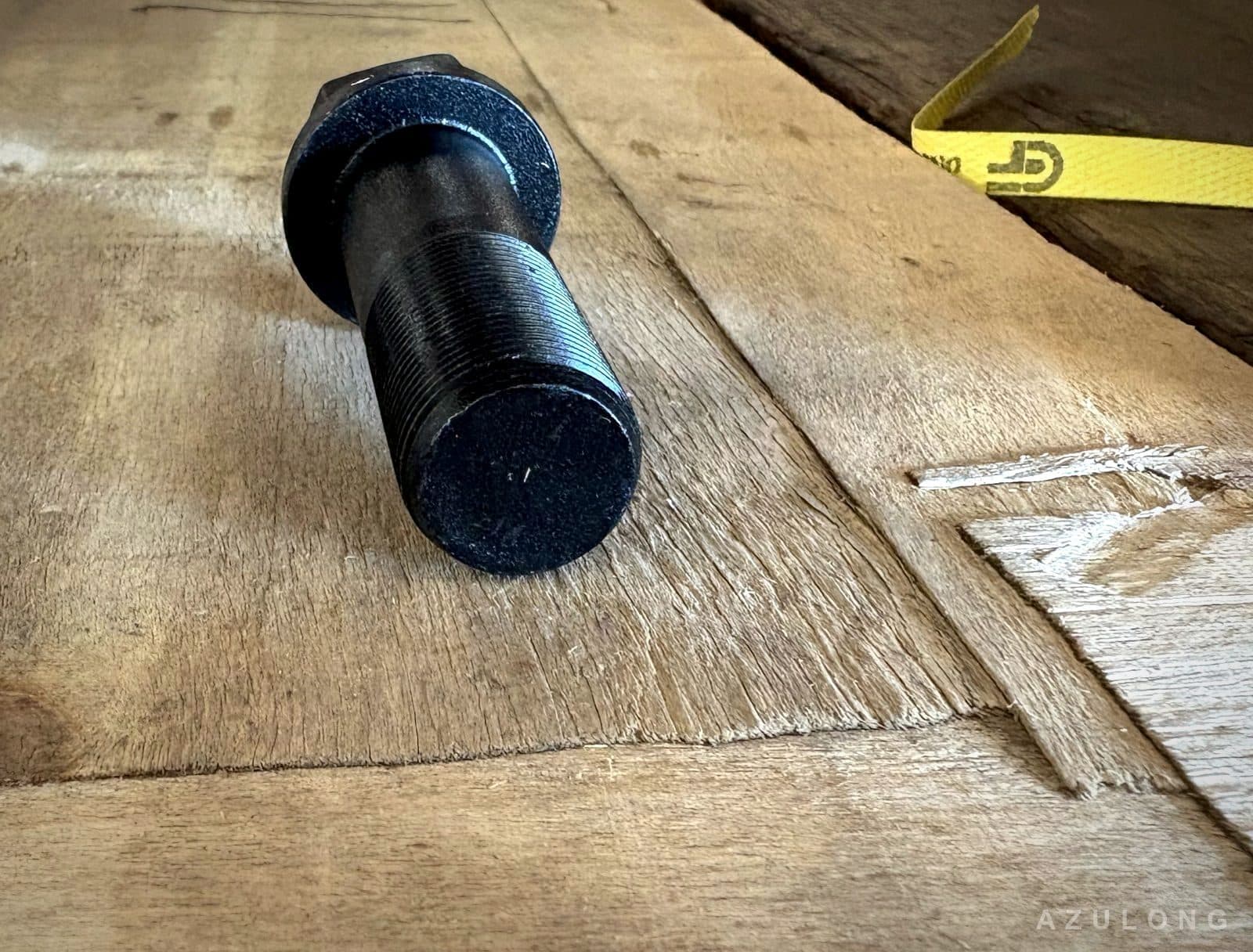 Black oxide track bolt on the workbench at AzuLong factory